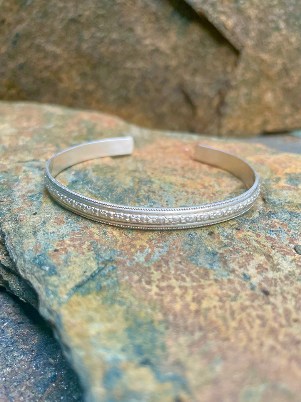 Sterling Silver Open Bangle with Center Floral Motif