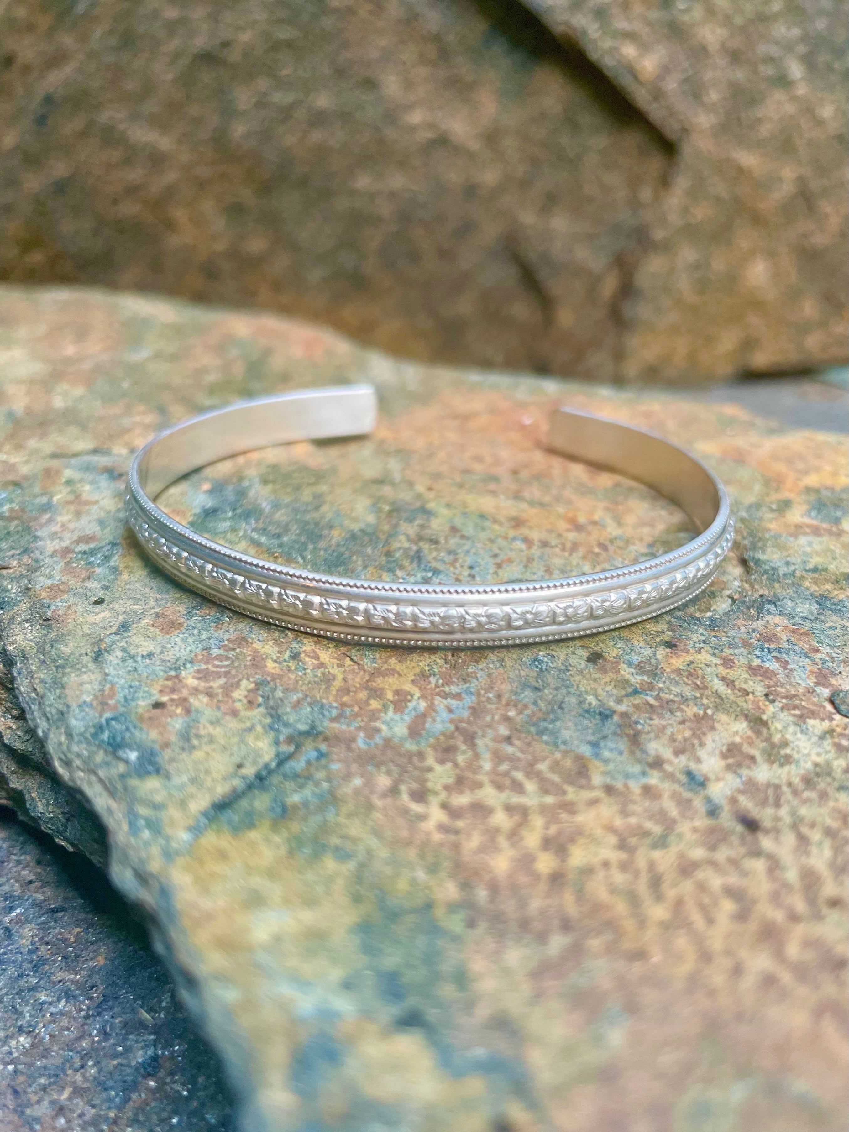 Sterling Silver Open Bangle with Center Floral Motif