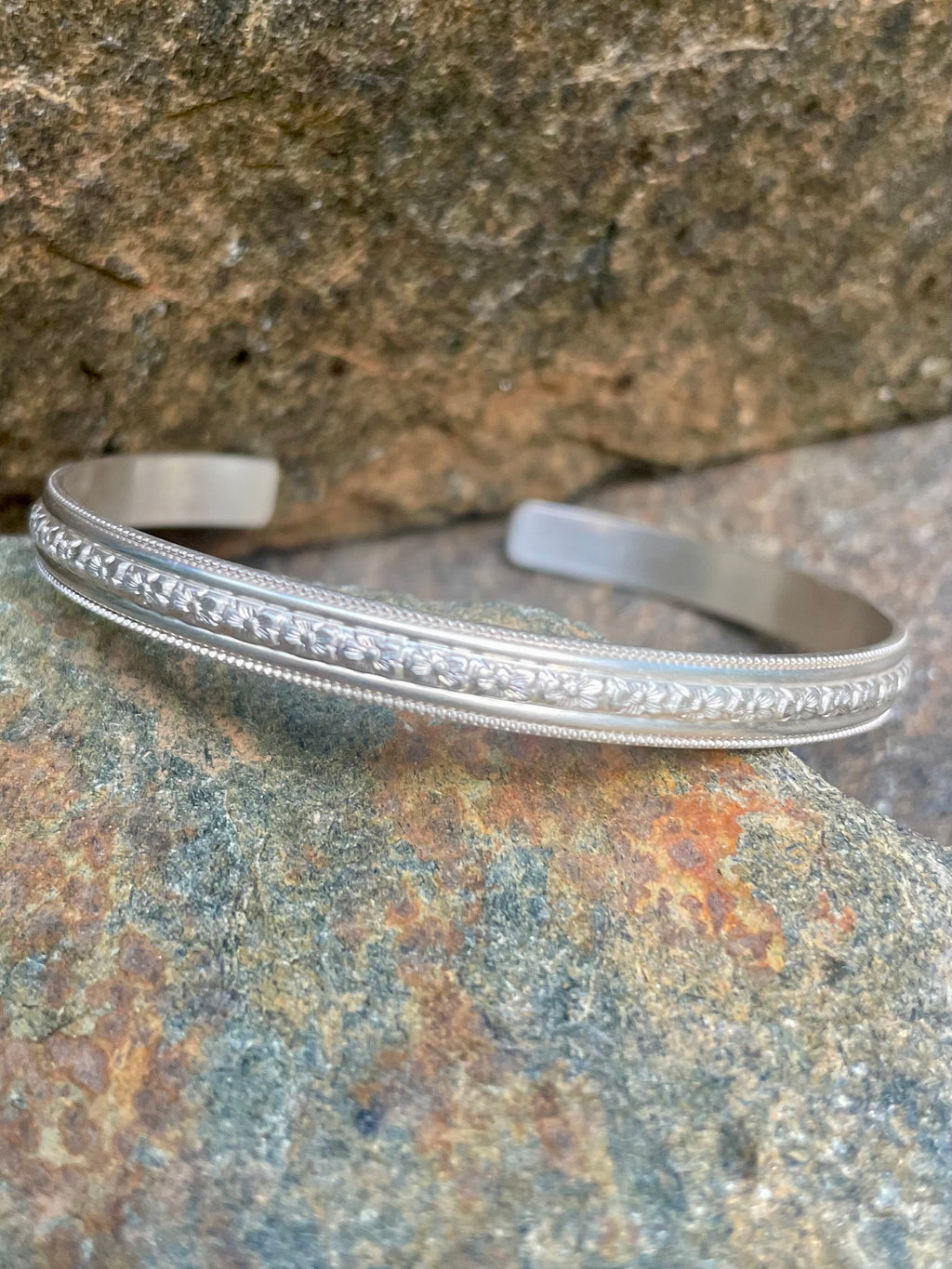 Sterling Silver Open Bangle with Center Floral Motif