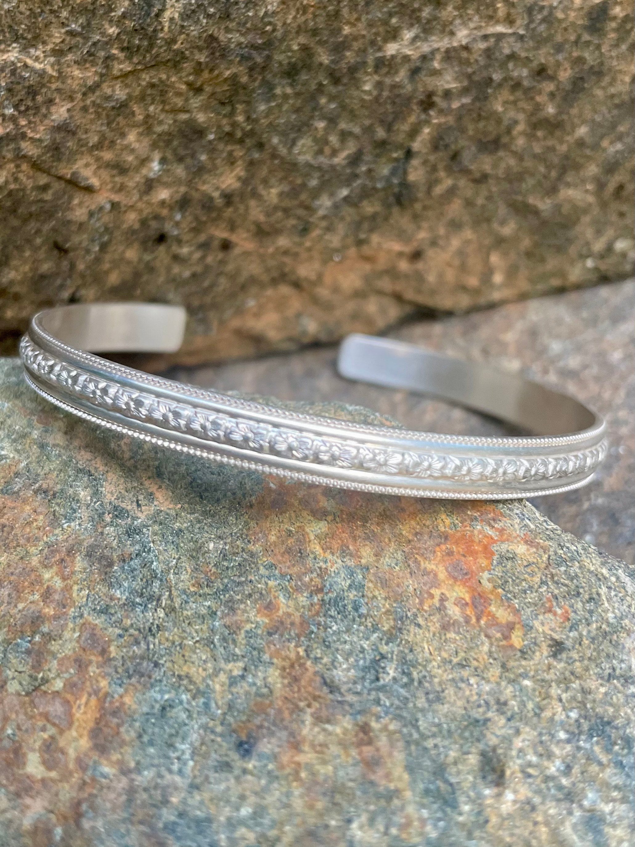 Sterling Silver Open Bangle with Center Floral Motif
